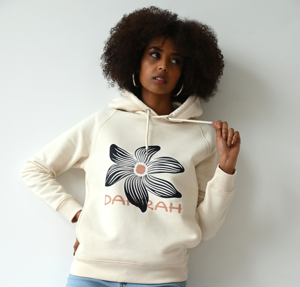 Beautiful high quality organic hoodie with print of a black flower by Dahrah Darah Fashion.