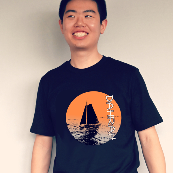 Dahrah Darah unisex organic cotton T-shirt with print of a sailboat in a lake.
