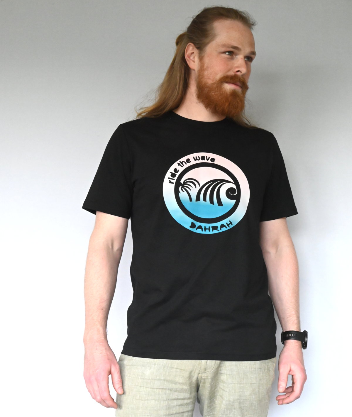 Dahrah Darah unisex organic cotton T-shirt with print of a blue wave and palm.