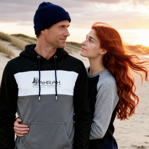 Unisex sailing hoodie with sailboat logo in three colors, nautical style.