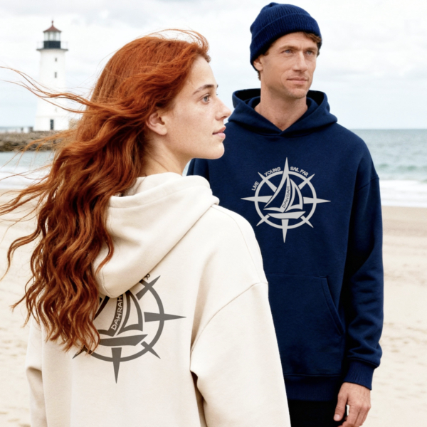 Oversized sailing hoodie with print of a wind rose and a sailboat. Unique and creative design for adventurous sailors and crews.